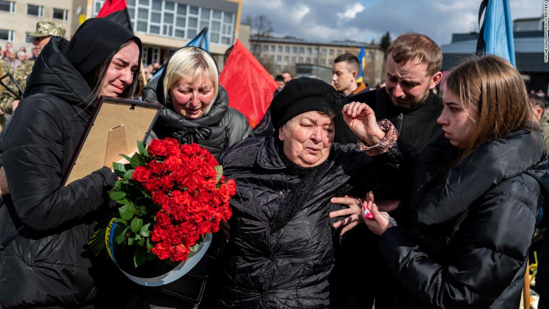Mourners react in Stebnyk, 우크라이나, during the funeral ceremony of Ukrainian serviceman Roman Tiaka. Tiaka was 47.