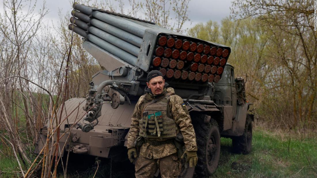 A Ukrainian serviceman stands next to a multiple rocket-launch system in the Kharkiv region of Ukraine on April 20.