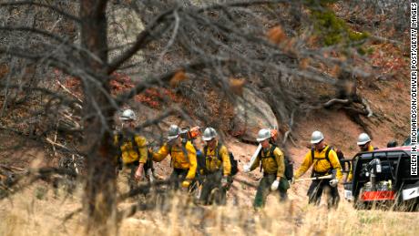 Firefighters heading toward a wildfire near Sedalia, Colorado, on April 17, 2018.
