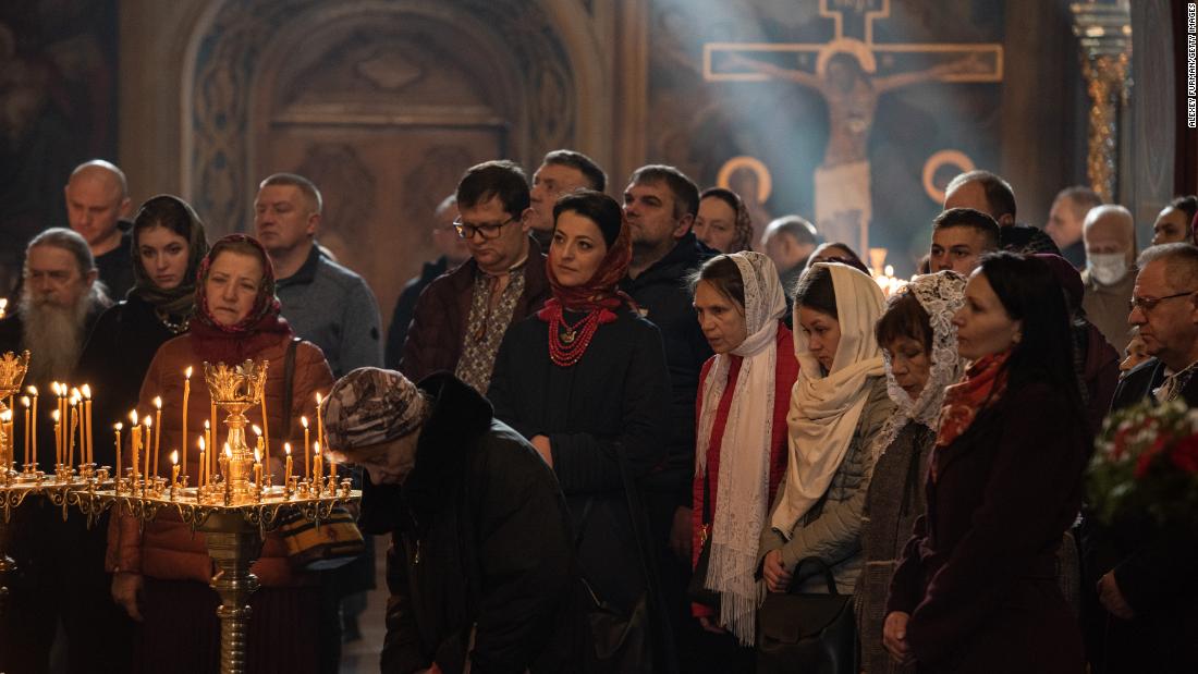 People pray during an &lt;a href =&quot;https://edition.cnn.com/2022/04/24/europe/ukraine-orthodox-easter-celebrations-intl-cmd/index.html&quot; target =&quot;_blank&ampquott;&gt;Easter&amltlt;/un&ampgtt; church service at St. Michael&#39;s Cathedral in Kyiv on April 24.