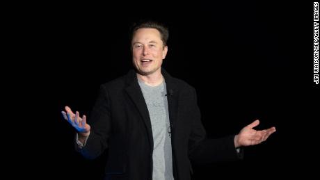 Elon Musk gestures as he speaks during a press conference at SpaceX&#39;s Starbase facility near Boca Chica Village in South Texas on February 10, 2022. Billionaire entrepreneur Elon Musk delivered an eagerly-awaited update on SpaceX&#39;s Starship, a prototype rocket the company is developing for crewed interplanetary exploration. 