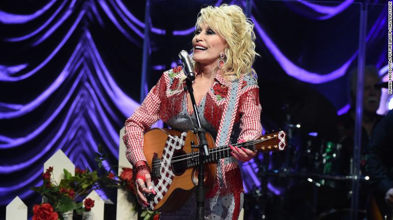 Dolly Parton now says she'd accept a spot in the Rock & Roll Hall of Fame if she's chosen