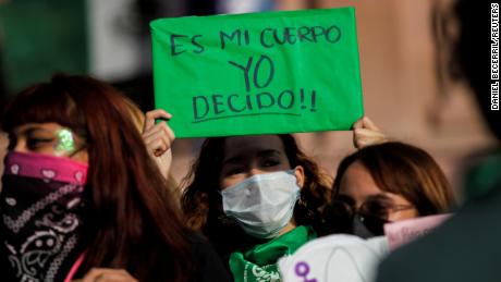 A woman holds up a banner that reads &quot;My body, I decide&quot; in Saltillo, Messico, after the country&#39;s Supreme Court ruled that penalizing abortion is unconsitutional in September. 