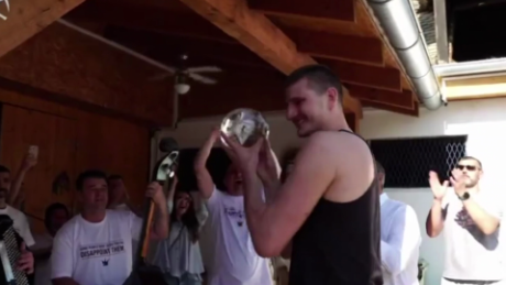 Jokic accepts his MVP award at a stable in Serbia. 