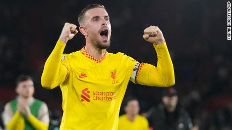 Liverpool&#39;s Jordan Henderson celebrates a crucial victory for his team. 