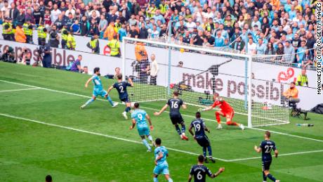 Manchester City&#39;s Ilkay Gundogan scores his side&#39;s third goal against Aston Villa.