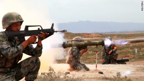 A Chinese People&#39;s Liberation Army (PLA) soldier fires an anti-tank rocket during a live-fire military exercise in Wuzhong, Ningxia Hui Autonomous Region, China in 2019. 