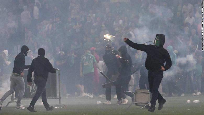 Chaos erupts as angry fans storm the pitch following the Saint-Étienne's relegation to Ligue 2