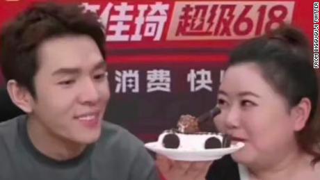 Chinese livestreamer Li Jiaqi and his co-host present a plate of ice cream that looks like a tank during his show on the eve of June 4.