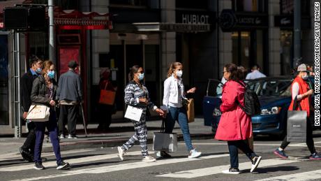 Pedestrians carry shopping bags in San Francisco, California, on Wednesday, June 1, 2022. US consumer sentiment has sunk to its lowest levels on record, according to preliminary data released Friday by the University of Michigan. 