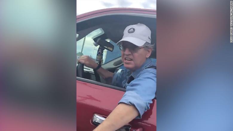 New York man who was caught on camera claiming to be an 'off-duty trooper' while going on a racist road rage tirade has been charged with a hate crime