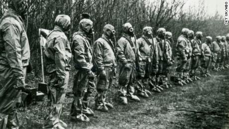 Liquidators lining up in their protective equipment in &#39;Chernobyl: The Lost Tapes.&#39;