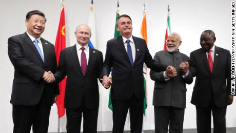In Beijing&#39;s BRICS summit, Putin is back on the world stage