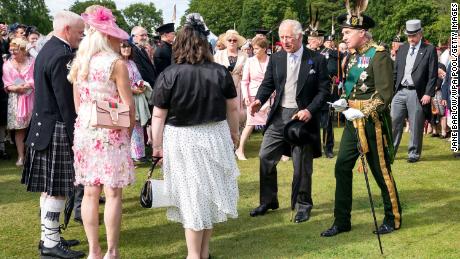 Prince Charles -- who&#39;s known in Scotland as the Duke of Rothesay -- appeared quite animated during a garden party at Holyroodhouse on Wednesday. The event sees thousands invited to spend a relaxed afternoon in the palace&#39;s verdant grounds, where royals mingle with guests, and regimental bands and the Royal Scottish Pipers&#39; Society perform.