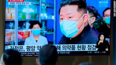 People in Seoul, South Korea, watch a TV news report about North Korean leader Kim Jong Un and his country&#39;s Covid outbreak on May 16, 2022. 