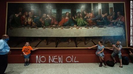 Activists glue themselves to copy of Leonardo&#39;S &#39;The Last Supper,&#39; adding to string of similar protests