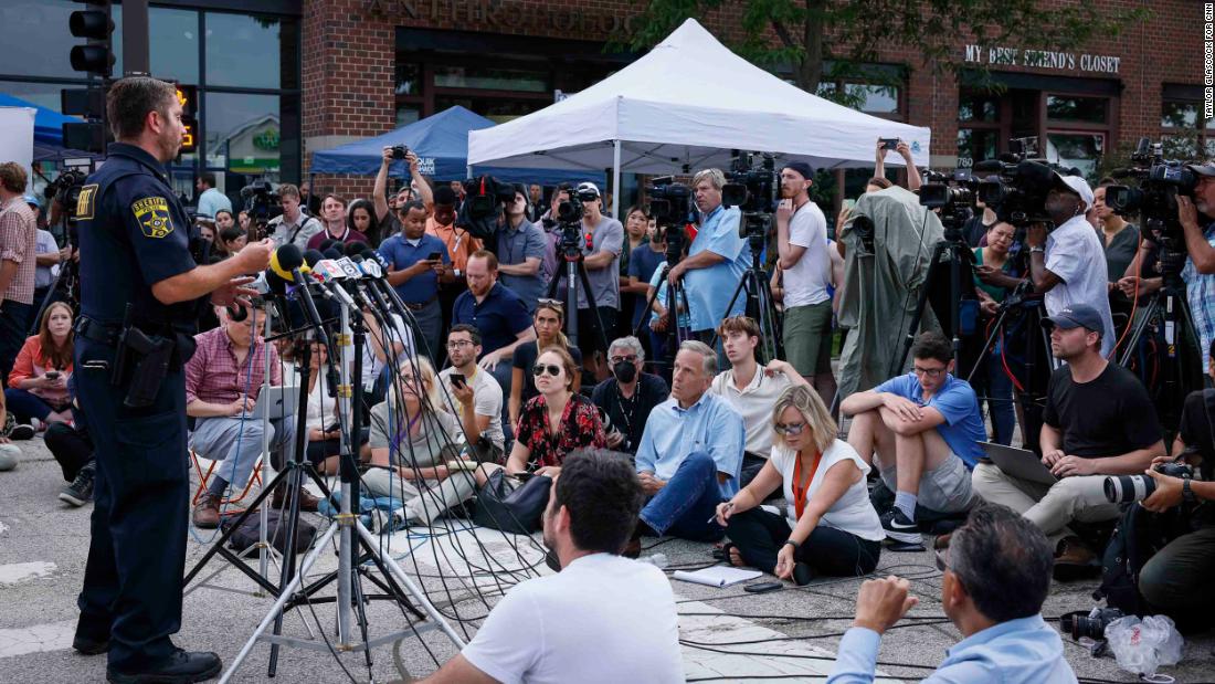 Journalists and residents listen during a press conference on July 5. 