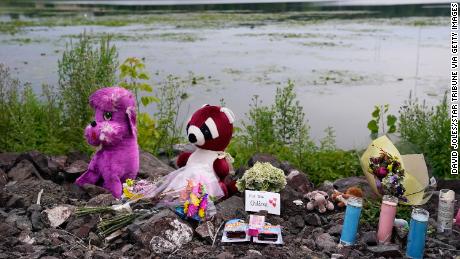 A memorial for the three children is seen on the edge of Vadnais Lake on Monday.