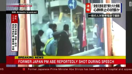 A screen grab from a video aired by NHK shows smoke in the air in the moments surrounding Abe's collapse