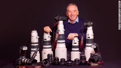 Sports photographer David Cannon poses with camera gear on March 7, 2017 in London,England.
