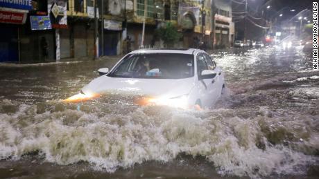 Pakistan&#39;s largest city battered by torrential rain as climate crisis makes weather more unpredictable