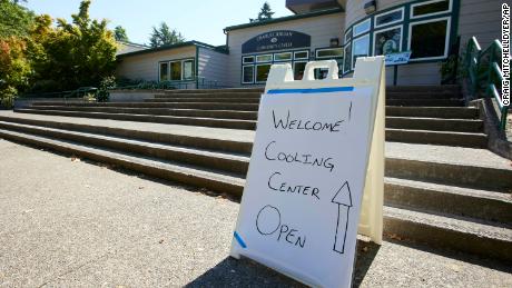 A sign showing that a cooling center at the Charles Jordan Community Center is open is shown in Portland, Oregon.