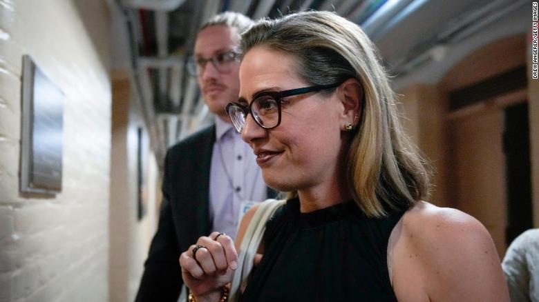 Sinema raises concerns about proposed tax in Democrats' bill as lobbying intensifies for her vote