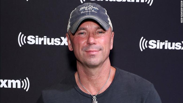 Kenny Chesney says he is 'devastated' after a woman fell to her death at his Denver concert