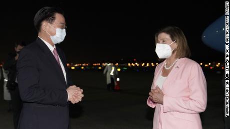 US House Speaker Nancy Pelosi is welcomed by Taiwanese Foreign Minister Joseph Wu after landing at Taipei Songshan Airport on August 2.