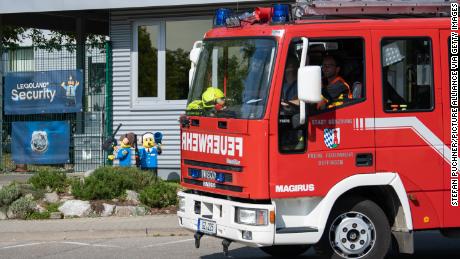 A fire truck drives past the entrance to Legoland in the Bavarian town.