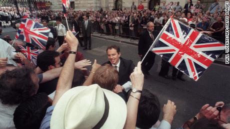 Tony Blair greets Labour supporters outside 10 Downing Street after a historic landslide election in May 1997. 