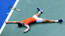 Alcaraz celebrates after winning the semifinal match against Tiafoe.