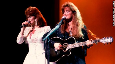 Country music duo the Judds, with Naomi Judd (left) and her daughter Wynonna, perform onstage, Chicago, Illinois, February 1, 1991. 