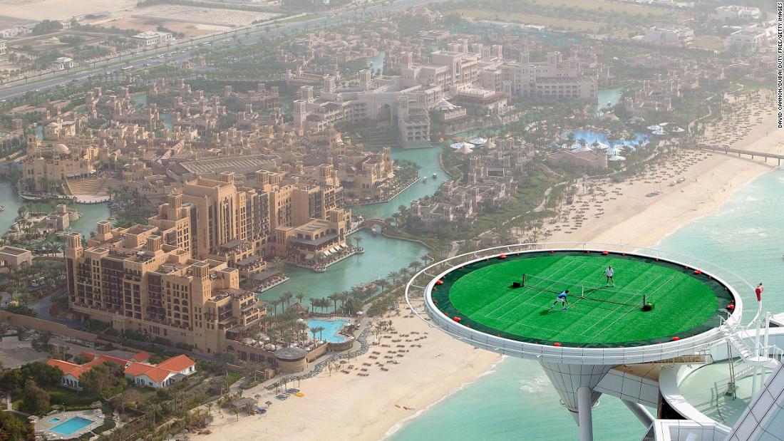 Federer and Andre Agassi hit balls on the helipad of the Burj Al Arab hotel in Dubai, United Arab Emirates, in 2005. It was ahead of a tournament in Dubai.
