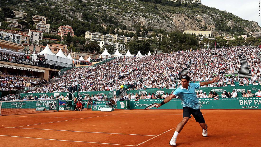 Federer returns a shot to Novak Djokovic during a match in Monaco in 2008.