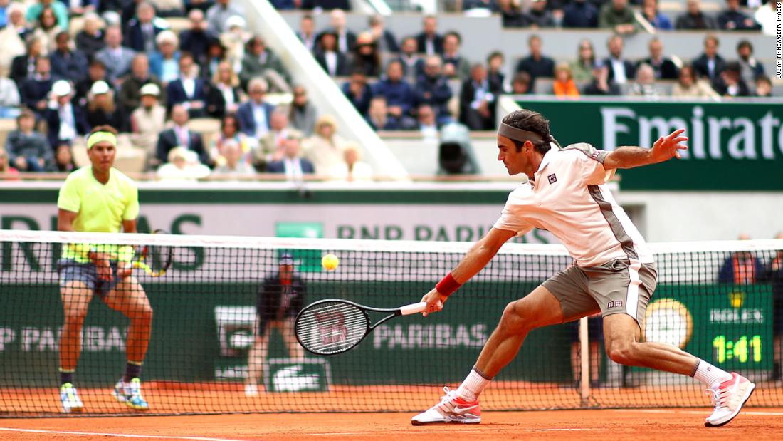 Federer plays a backhand to Nadal during a French Open semifinal in 2019.