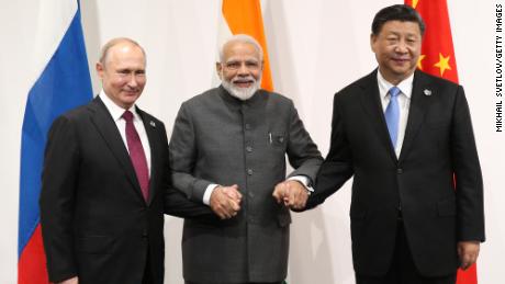 Russian President Vladimir Putin, Indian Prime Minister Narendra Modi and Chinese President Xi Jinping pose for a group photo prior to their trilateral meeting at the G20 Osaka Summit 2019 on June 28, 2019 in Osaka, Japan.