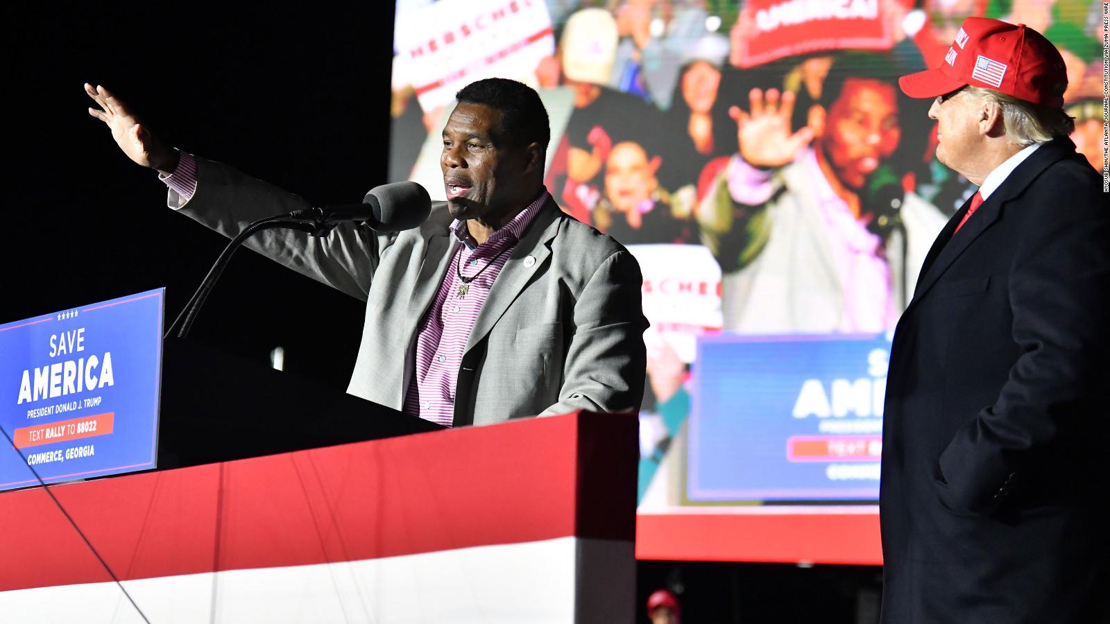 October 4, 2022: In this photo from March 26, 2022, Herschel Walker, the front-runner for the party’s U.S. Senate nominee, speaks as former President Donald Trump looks during a rally for Georgia GOP candidates at Banks County Dragway in Commerce. (Credit Image: © Hyosub Shin/The Atlanta Journal-Constitution via ZUMA Press Wire)