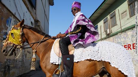 Sadiq poses for a photograph on his horse in Accra, Ghana