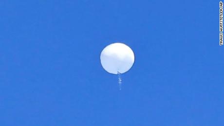 In this photo provided by Travis Huffstetler Photography, a large balloon drifts above the Atlantic Ocean, just off the coast of the Carolinas, Saturday, February 4, 2023. 