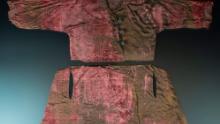 A velvet robe made with expensive red dye was found in the same chest as the gowns.