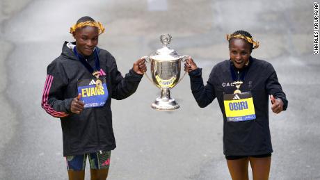 Evans Chebet, left, and Hellen Obiri, both of Kenya, pose on the finish line after winning the men&#39;s and women&#39;s division of the Boston Marathon, Monday, April 17, 2023, in Boston. (AP Photo/Charles Krupa)