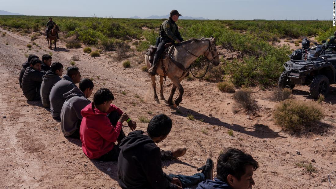 Migrants wait to be processed by US Border Patrol agents in Santa Teresa, New Mexico, on April 26.