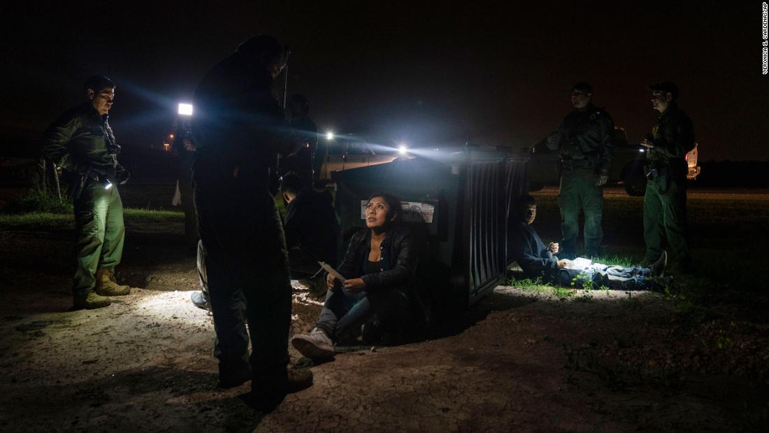 Migrants who were trying to evade US Border Patrol agents wait to be processed in Granjeno, Texas, on May 4.