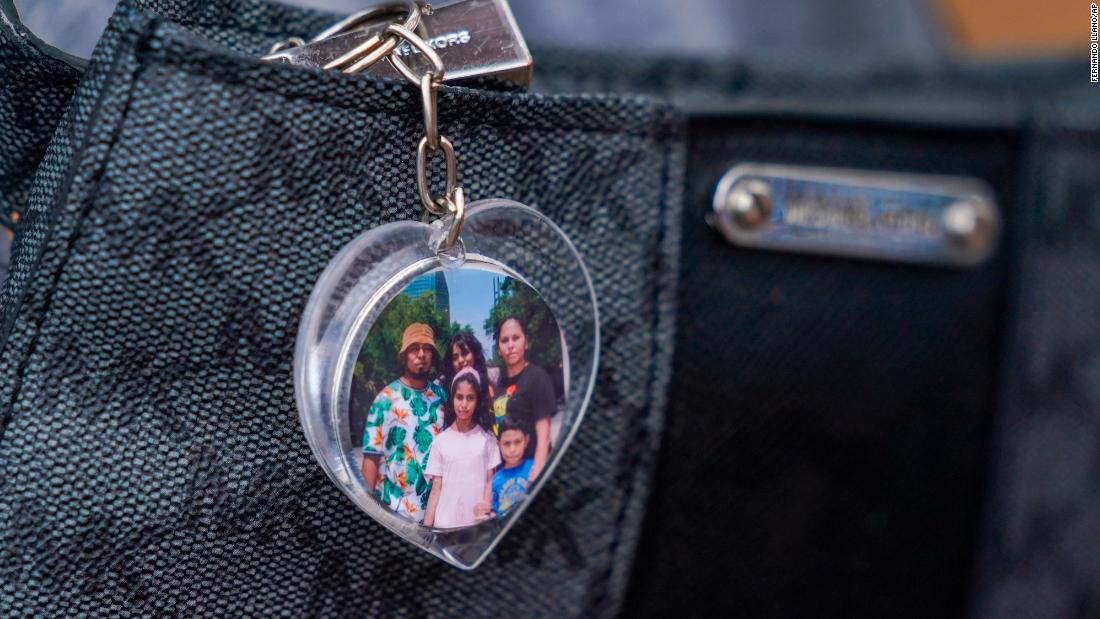 A heart-shaped keychain with a photo of Salvadoran migrant Danilo Ruiz and his family hangs from a handbag at a makeshift shelter in Reynosa, Mexico, on Tuesday, May 9.