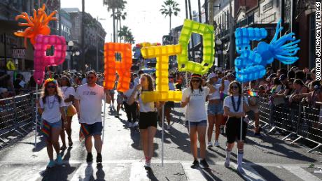 TAMPA, FL - MARCH 26: Revelers celebrate on 7th Avenue during the Tampa Pride Parade in the Ybor City neighborhood on March 26, 2022 in Tampa, Florida. The Tampa Pride was held in the wake of the passage of Florida&#39;s controversial &quot;Don&#39;t Say Gay&quot; Bill. 