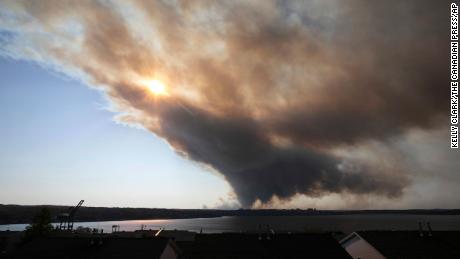 Thick plumes of heavy smoke fill the Halifax sky as an out-of-control fire in a suburban community quickly spread, engulfing multiple homes and forcing the evacuation of local residents, in Halifax, Nova Scotia, on Sunday May 28, 2023.