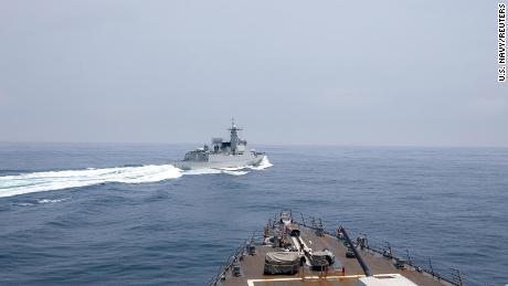 Chinese warship Luyang III sails near the U.S. destroyer USS Chung-Hoon, as seen from the deck of U.S. destroyer, in the Taiwan Strait, June 3, 2023, in this handout picture.