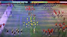 Dancers take the field during the opening ceremony.