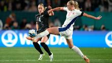 New Zealand's CJ Bott, left, and Norway's Mathilde Harviken vie for the ball.